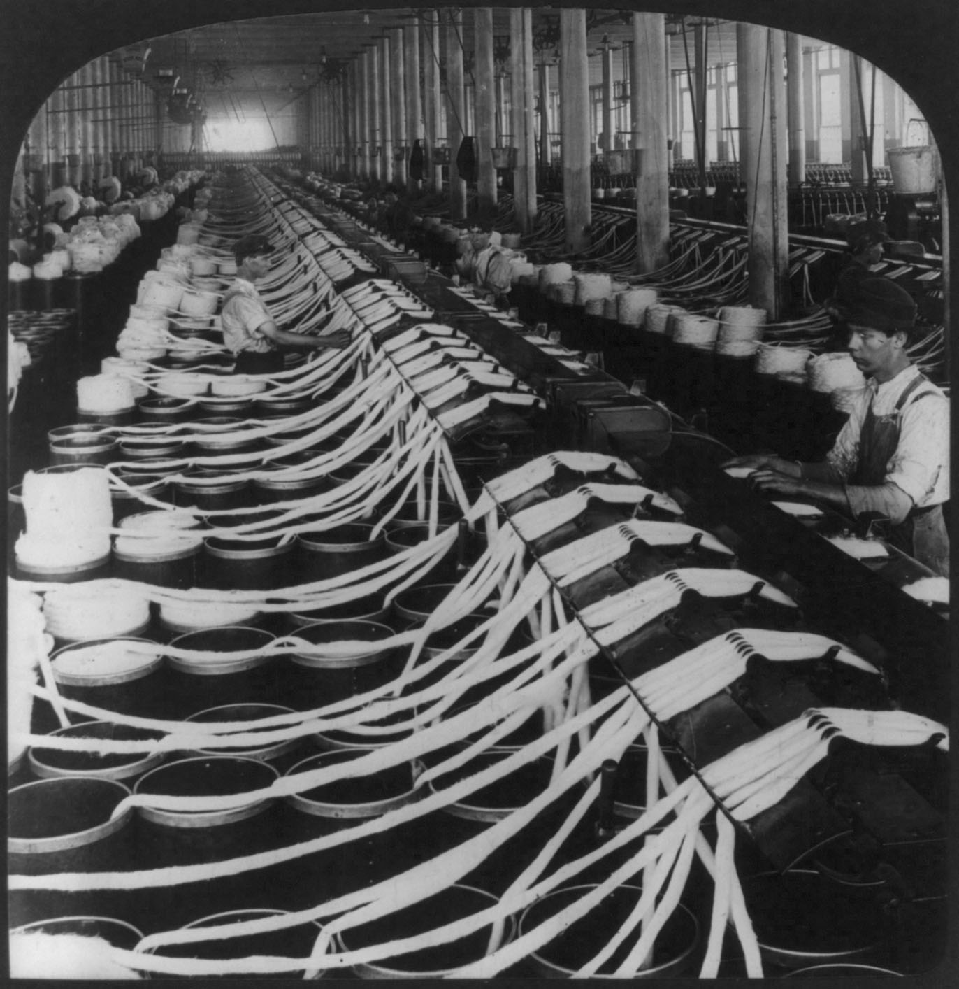 A worker at White Oak Mills in Greensboro, North Carolina, makes yarn.