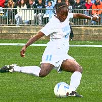 Girl playing soccer. Click here to take the NC Sports Trivia Quiz