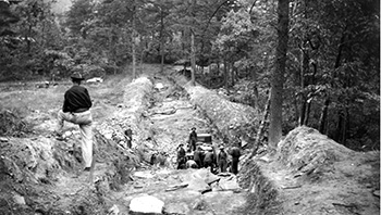 Workers in the Civilian Conservation Corps at the rock quarry during dam construction, ca. 1935-1942, at Hanging Rock State Park. Image from the collection of North Carolina State Parks.