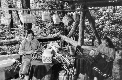 Basket weavers demonstrate their craft at the Oconaluftee Indian Village in Cherokee. Photograph courtesy of North Carolina Division of Tourism, Film, and Sports Development.